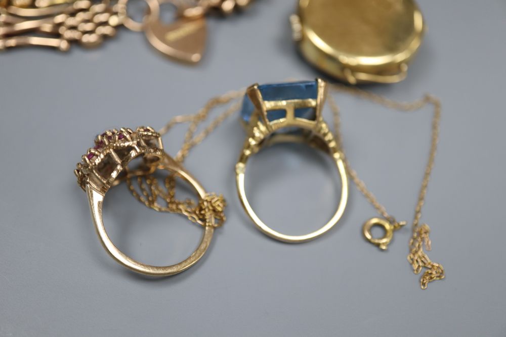 A 9ct gold gate-link bracelet, two 9ct and gem set rings, a 9ct fine chain and a ladys 18ct gold wrist watch.